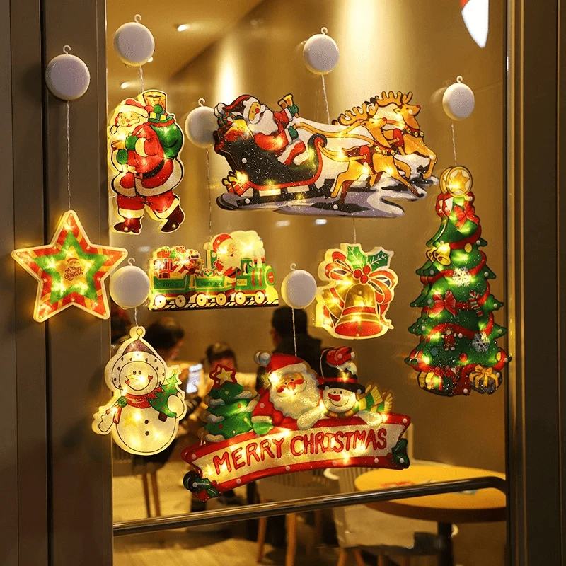 Colgando luces navideñas Bébé Filou